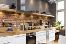 22 a brick backsplash adds texture and interest to the space and contrasts the sleek countertop