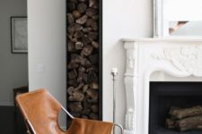 22 a stylish minimalist metal firewood holder next to the fireplace contrasts it refined and very vintage design