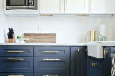 22 navy and white is always a timeless solution, a white subway tile backsplash is a cool idea and brass handles add chic