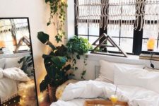 23 potted greenery in the corner refreshes this small bedroom at once