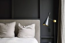 24 a stylish contemporary bedroom with a black paneled wall for an accent and some other black touches for more chic