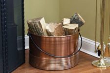 25 a copper bucket is a great and simple idea to store some firewood with a rustic feel