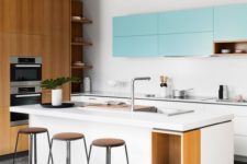 25 white and light blue cabinets plus much light-colored wood for a fresh modern look