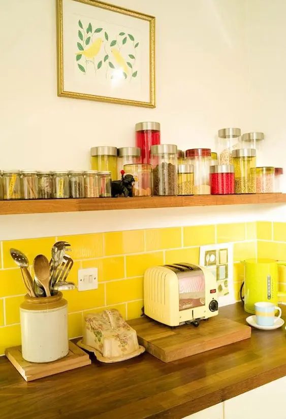a bright yellow subway tile backsplash is a cool and sunny touch to your neutral kitchen is a very lovely idea