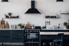 a contemporary industrial kitchen with metal wooden cabinets, white brick walls, vintage lamps and stools