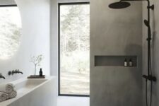 a minimalist concrete bathroom with a built-in vanity and a sink, a shower space, a glazed wall and black fixtures