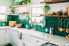a neutral modern kitchen with black handles, with a bold emerald brick backsplash and open shelves is a very cool and chic idea