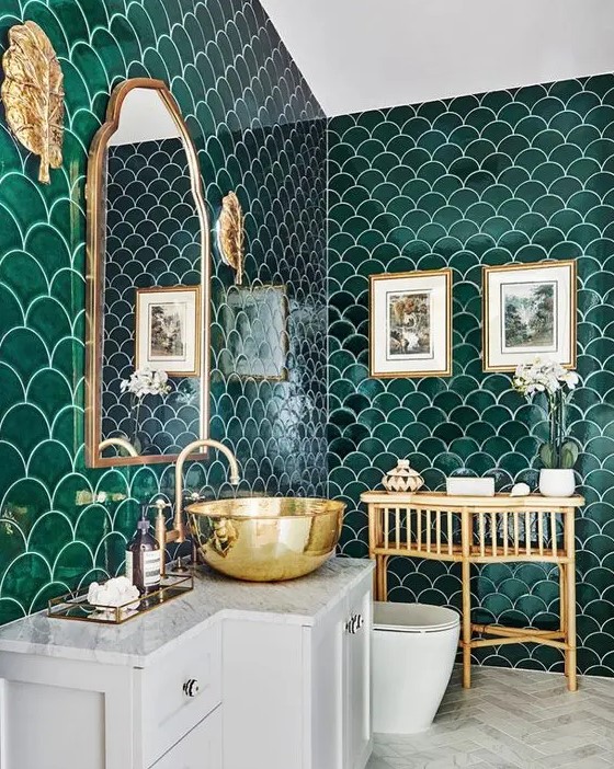 an emerald fish scale tile bathroom, with white appliances and gold touches here and there is very elegant