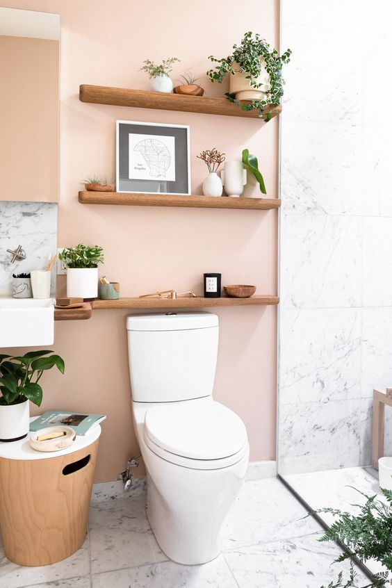 blush walls paired with white marble tiles and light stained wood look cool and very tender at the same time