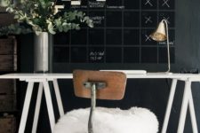 06 a moody Scandinavian home office with a chalkboard wall and a calendar for a whole month