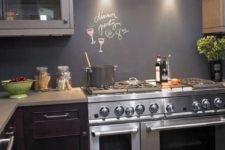 10 a dark modern kitchen with a chalkboard backsplash as a budget-friendly and cool idea to stand out