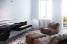 11 a minimalist living room with a wlal-mounted fireplace, a black desk and brown leather furniture for an eye-catchy look