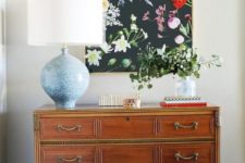 12 a moody floral artwork with realistic blooms looks very refined and will spruce up any space