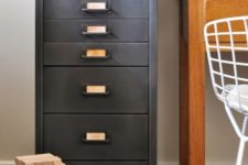 24 a vintage filing cabinet refinished with chalkboard paint that gives it a worn and very refined vintage feel