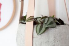 25 a concrete planter suspended using leather straps is a stylish and ultra-modern idea to try