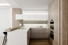 a clean ultra-minimalist kitchen with sleek white and wooden cabinets, a wooden raised countertop, built-in lights and a concrete backsplash