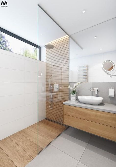 a minimalist bathroom with neutral tiles, sleek wooden touches, a cocnrete wall, a large mirror and a small window