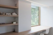 a shared ultra-minimalist home office in white, with curved chairs, open shelves and built-in lights