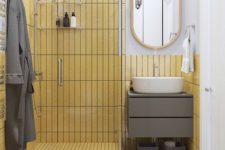 a cool shower space clad with yellow tiles