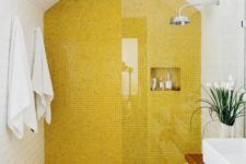 07 a modern bathroom with a lemon yellow tile shower and floor plus all white around looks bright and very fresh