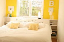 07 a small bedroom with a yellow accent wall and mustard pillows plus neutrals looks cool