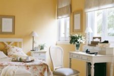 11 a charming vintage cottage bedroom with yellow walls, neutrals and floral prints is very romantic