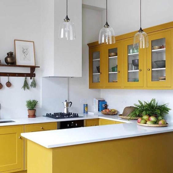 a chic contemporary kitchen in mustard, with all white everything is a bold and stylish option