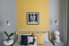 14 a stylish contemporary bedroom with a yellow stripe that goes up and mustard and grey bedding