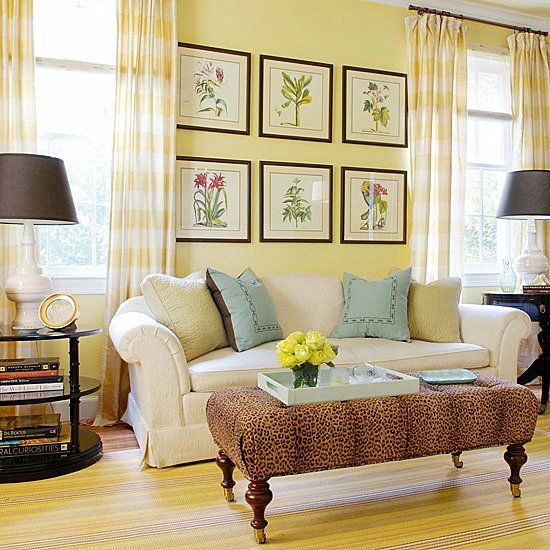 a bright vintage-infused living room with light yellow walls, yellow plaid curtains, elegant furniture and yellow textiles