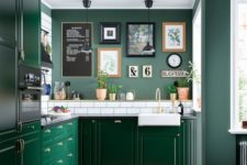 a chic green kitchen with green walls, bright emerald cabinets, a white subway tile backsplash for a fresh touch