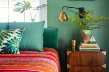 a green bedroom with colorful touches