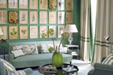 a lovely green living room with green walls, curtains and striped furniture, with a large vintage gallery wall