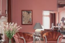 a refined living room with pink walls and a layered pink ceiling, a pink printed floor, gorgeous mauve chairs and touches of gold