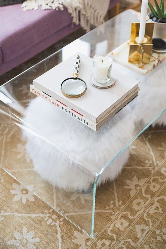 a sheer acrylic coffee table is a nice addition to a modern living room, it looks glam and chic