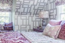 26 a white, grey and lilac bedroom with prined wallpaper, floral curtains, pink and lilac textiles is romantic and pretty