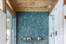 a cozy bathroom with a rustic wooden ceiling