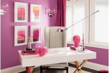 a bright purple and hot pink home office with purple walls, fuchsia curtrains, a quirky burst chandelier and fuchsia chairs