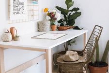 a neutral boho home office with a simple table, a woven chair, potted plants and cacti, a grid with various ideas