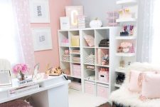 a refined girlish home office with a pink accent wall, pink accessories and furniture and touches of gold for more glam