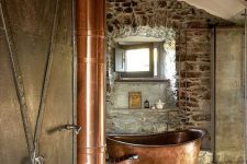 bathroom with cool rustic touches and a copper tub