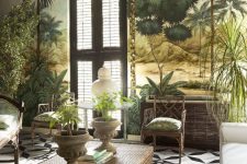 a tropical living room with catchy wallpaper, vintage-inspired rattan furniture, potted greenery and a mosaic tile floor