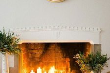 a cozy fireplace with lots of candles