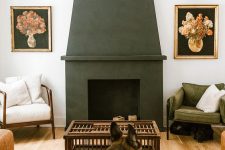 a stylish mid-century modern living room with a black concrete fireplace, a leather sofa and white and green chair
