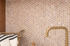 a warm terracotta penny tile backsplash matches the wood and a brass faucet and brings a cozy feel
