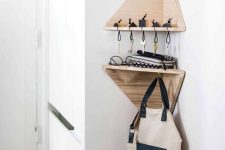 02 tiny geometric corner shelves with a key holder and some hooks are a great idea for a tiny entryway