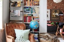05 a cozy and chic reading nook with a rust velvet wingback chair , a bookshelf and a basket with faux fur