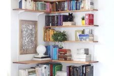 07 a large open shelving unit covering the corner is a lovely idea to use this space and make the use of it