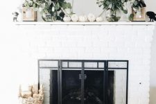 07 modern fall mantel decor with eucalyptus in clear vases, white pumpkins and candle lanterns is very easy to recreate