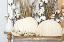 08 a rustic fall arrangement – cotton, wheat and white pumpkins in a vintage rustic bathtub plus white candles