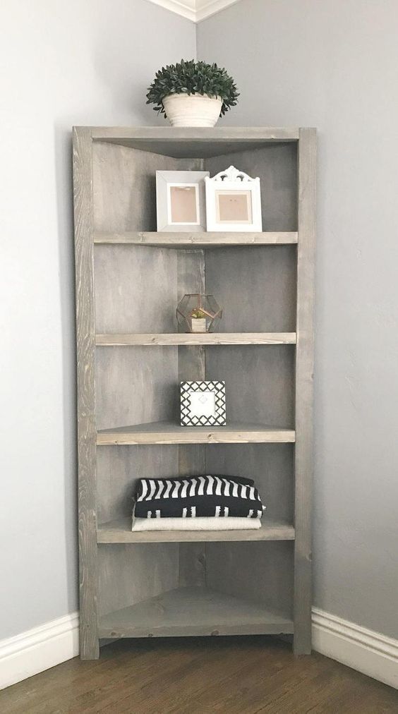 a rustic corner open shelving unit of light stain is a stylish idea for a rustic or vintage space
